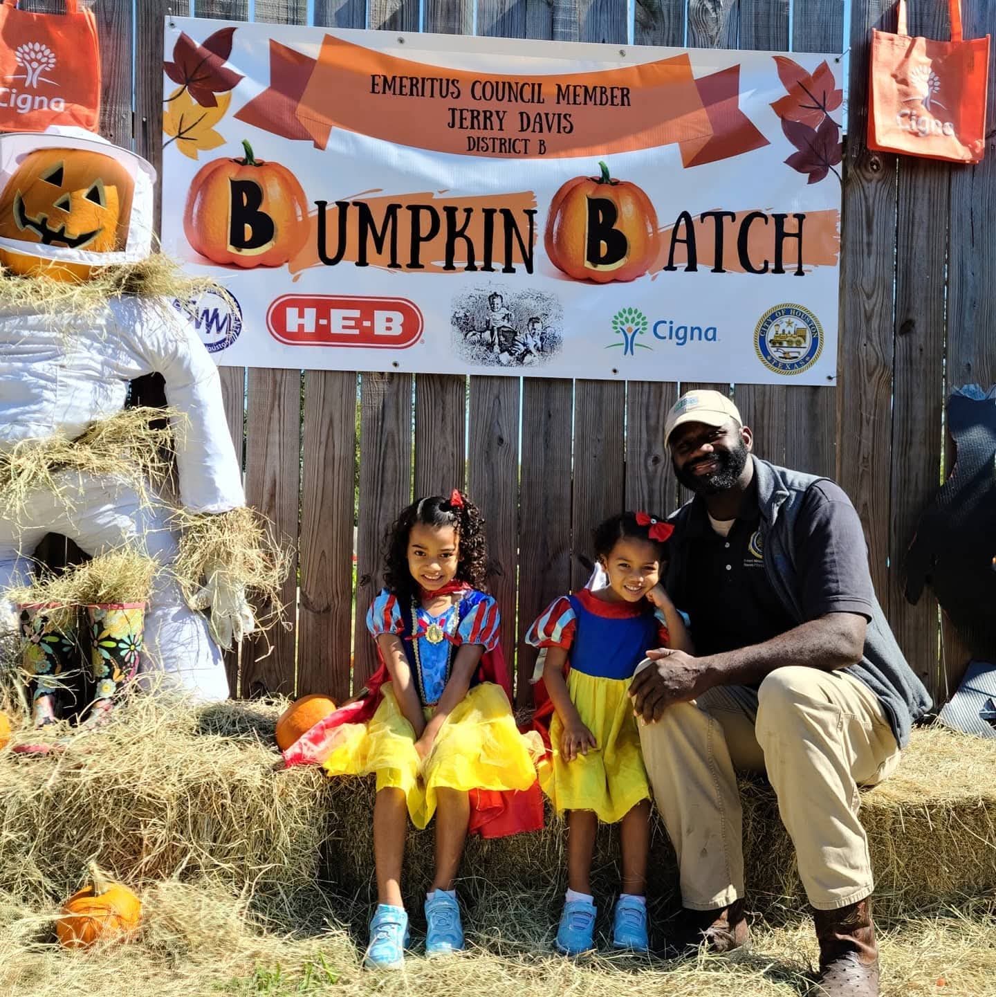 Jerry Davis with children at the District B Bumpkin Batch community event